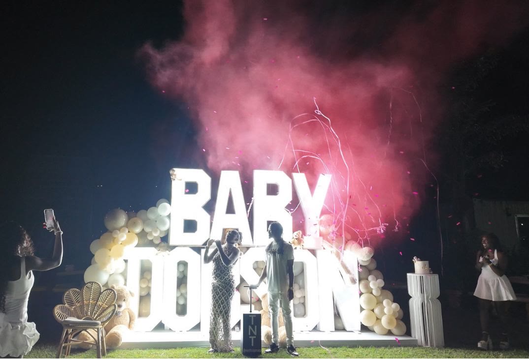 Gender reveal with pink smoke cannon and marquee letters in Jamaica