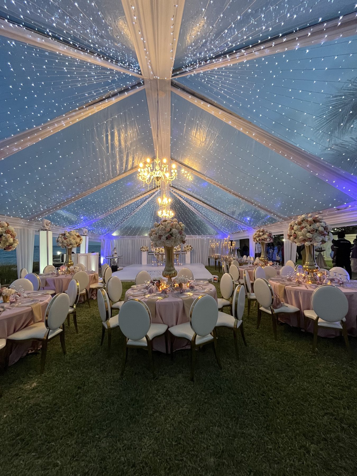 Styled reception under a lit tent